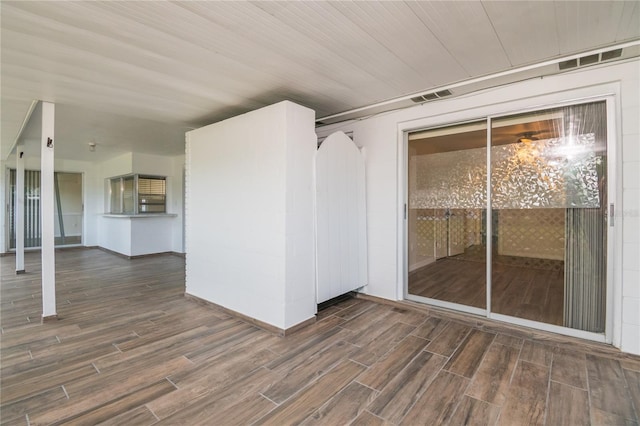 3406 Rock Royal Dr, Holiday, FL 34691 - empty room featuring wood finished floors and baseboards
