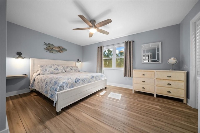 12046 W Gulf Breeze Ct, Crystal River, FL 34429 - bedroom featuring wood finished floors and ceiling fan