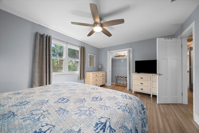 12046 W Gulf Breeze Ct, Crystal River, FL 34429 - bedroom with wood finished floors, a closet, and ceiling fan