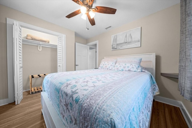12046 W Gulf Breeze Ct, Crystal River, FL 34429 - bedroom with wood finished floors and ceiling fan