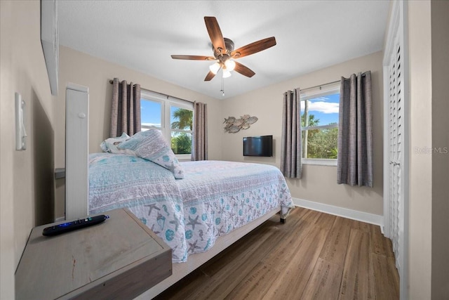 12046 W Gulf Breeze Ct, Crystal River, FL 34429 - bedroom featuring wood finished floors and a ceiling fan