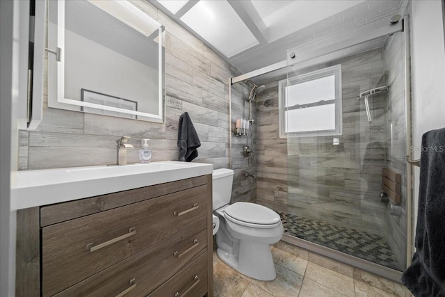 12046 W Gulf Breeze Ct, Crystal River, FL 34429 - bathroom with vanity, a shower stall, and tile walls