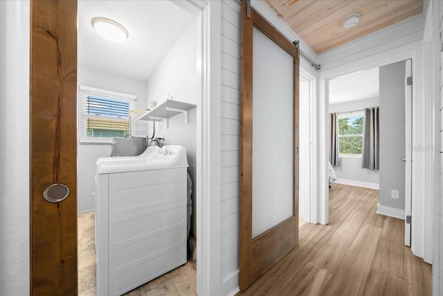 12046 W Gulf Breeze Ct, Crystal River, FL 34429 - laundry area with washer / clothes dryer and light wood-style floors