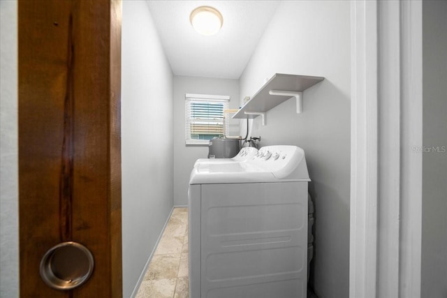 12046 W Gulf Breeze Ct, Crystal River, FL 34429 - laundry area featuring independent washer and dryer and light stone finish flooring
