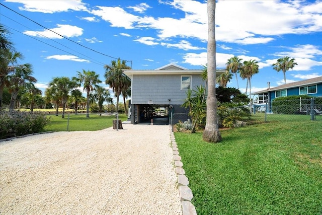 12046 W Gulf Breeze Ct, Crystal River, FL 34429 - view of front of house with driveway and a carport