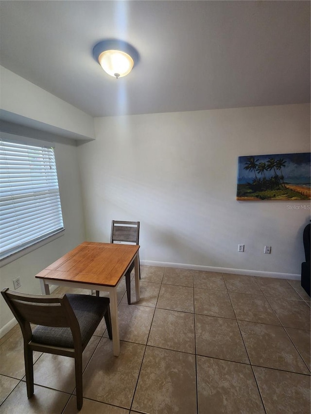 1975 W Bay Dr Unit 304, Largo, FL 33770 - tiled dining room with baseboards