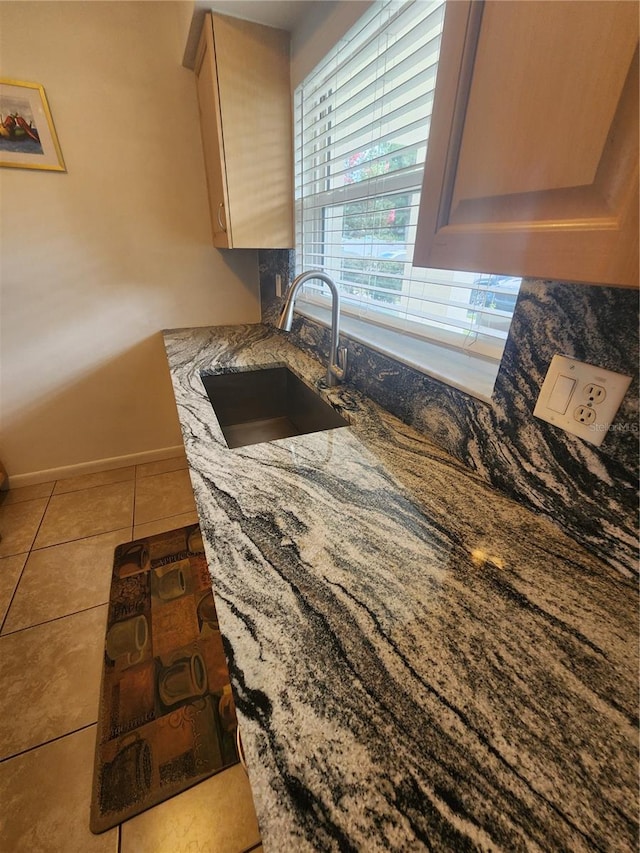 1975 W Bay Dr Unit 304, Largo, FL 33770 - kitchen with light stone countertops and tile patterned flooring