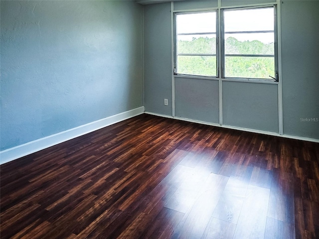 3315 58th Ave S Unit 409, Saint Petersburg, FL 33712 - spare room with dark wood-style floors
