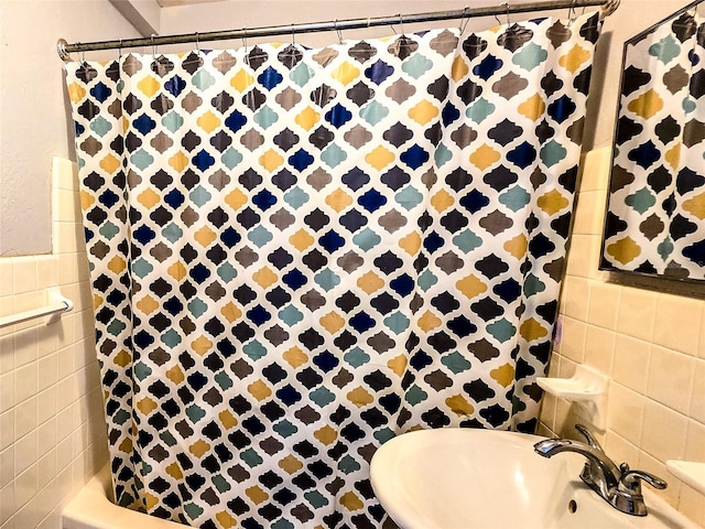 3315 58th Ave S Unit 409, Saint Petersburg, FL 33712 - full bathroom featuring tile walls and a sink
