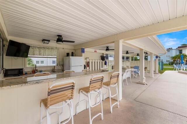 1370 Heather Ridge Blvd Unit 105, Dunedin, FL 34698 - view of patio with ceiling fan