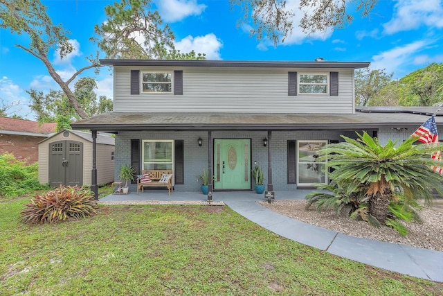 3731 Southview Dr, Brandon, FL 33511 - traditional home featuring covered porch, a storage shed, brick siding, and a front lawn