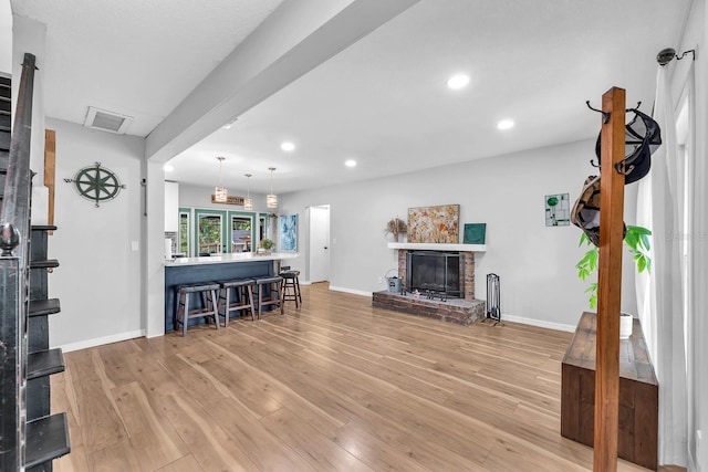 3731 Southview Dr, Brandon, FL 33511 - living area featuring light wood-style flooring, recessed lighting, and a brick fireplace
