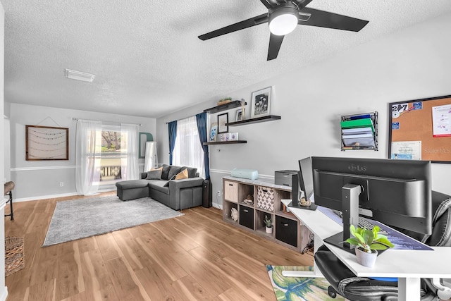 3731 Southview Dr, Brandon, FL 33511 - office with a textured ceiling, ceiling fan, and wood finished floors