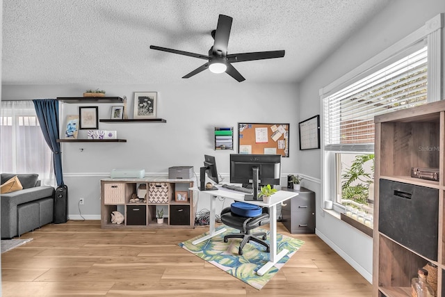 3731 Southview Dr, Brandon, FL 33511 - office featuring a textured ceiling, a ceiling fan, and wood finished floors