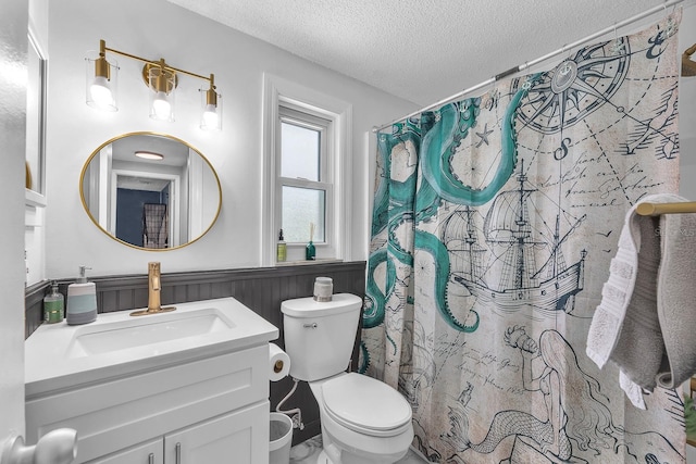 3731 Southview Dr, Brandon, FL 33511 - bathroom featuring a textured ceiling, wainscoting, vanity, and a shower with curtain