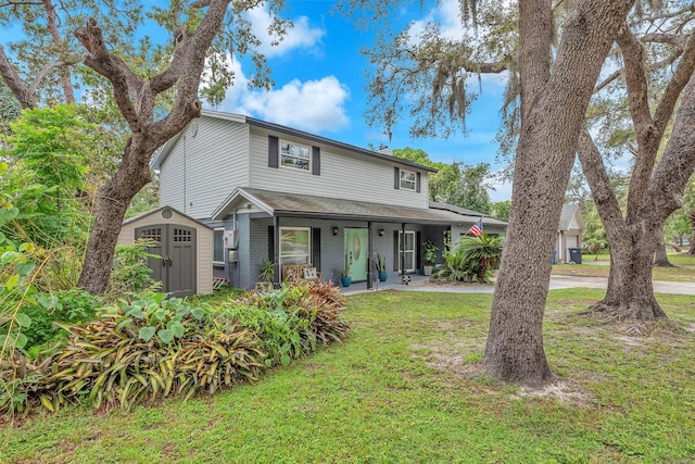 3731 Southview Dr, Brandon, FL 33511 - traditional home featuring a front yard, a storage unit, a porch, and brick siding