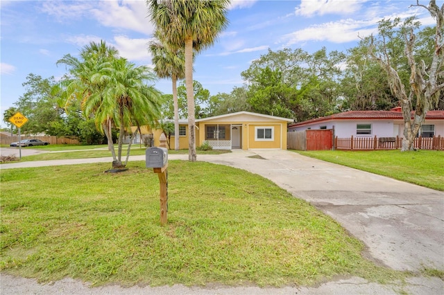 4923 Avery Rd, New Port Richey, FL 34652 - view of front of house featuring concrete driveway and stucco siding