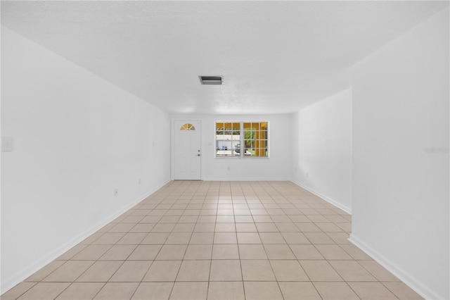 4923 Avery Rd, New Port Richey, FL 34652 - unfurnished room with light tile patterned floors and baseboards