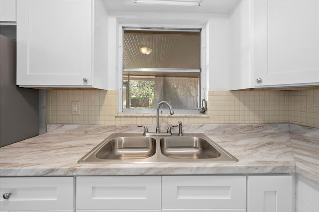 4923 Avery Rd, New Port Richey, FL 34652 - kitchen featuring white cabinets and backsplash