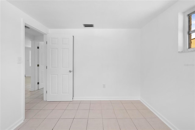 4923 Avery Rd, New Port Richey, FL 34652 - spare room with light tile patterned floors
