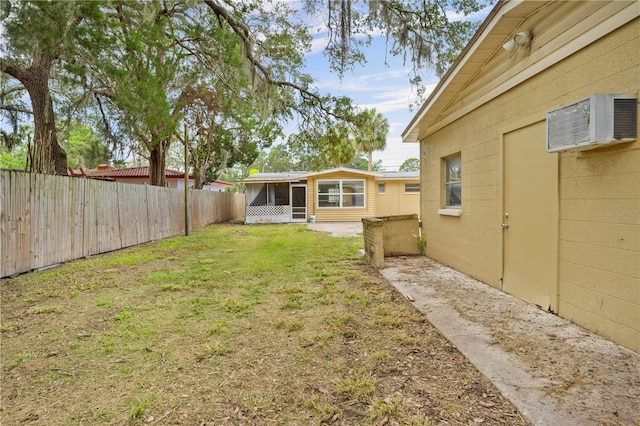 4923 Avery Rd, New Port Richey, FL 34652 - fenced backyard with a sunroom and an AC wall unit