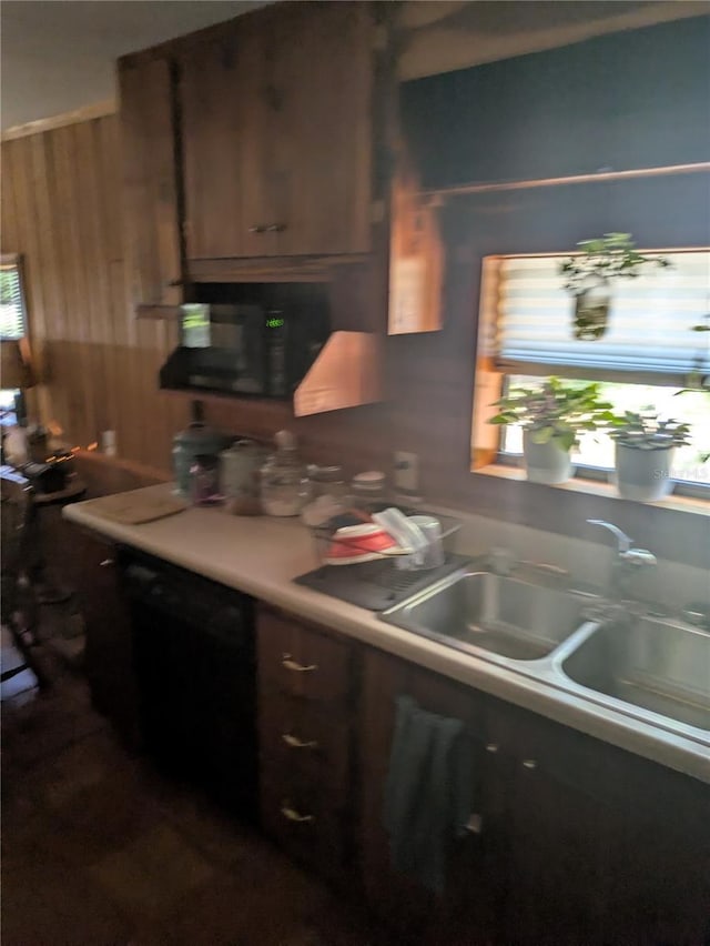 2833 SW Wilson Springs Rd, Fort White, FL 32038 - kitchen with wooden walls, black microwave, and light countertops
