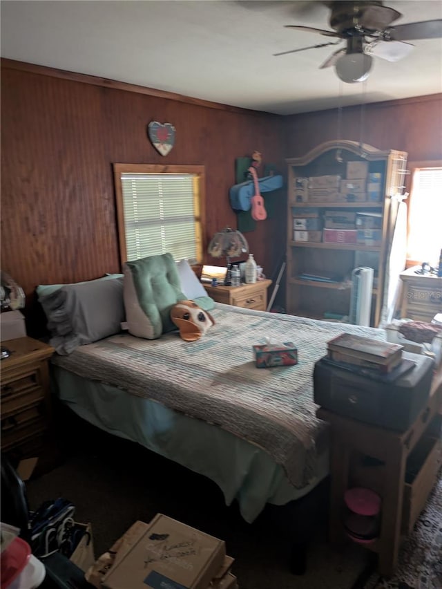2833 SW Wilson Springs Rd, Fort White, FL 32038 - bedroom featuring wood walls and ceiling fan