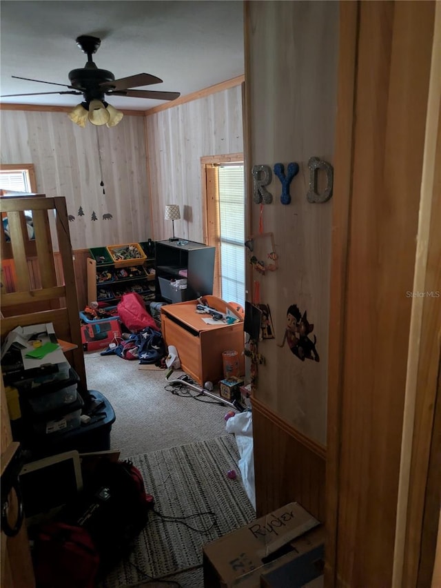 2833 SW Wilson Springs Rd, Fort White, FL 32038 - bedroom with carpet flooring, wooden walls, and a ceiling fan