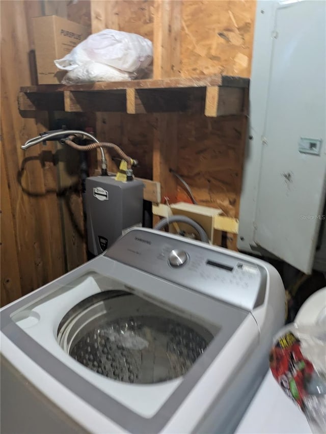 2833 SW Wilson Springs Rd, Fort White, FL 32038 - laundry view of washer / clothes dryer and wood walls
