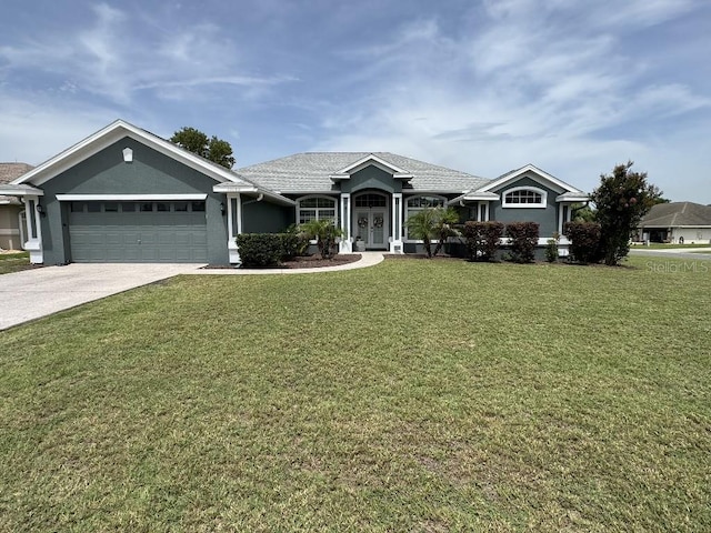 10080 SE 69th Ter, Belleview, FL 34420 - ranch-style home with a garage, a front yard, driveway, and stucco siding