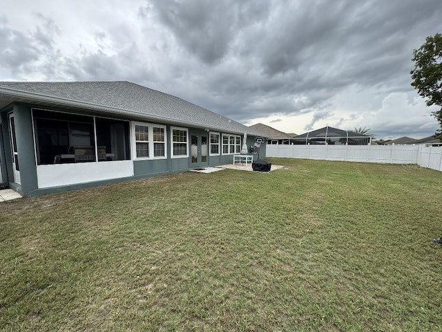 10080 SE 69th Ter, Belleview, FL 34420 - back of house with a patio area and a shingled roof