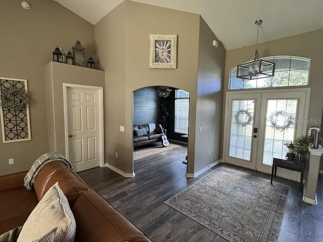 10080 SE 69th Ter, Belleview, FL 34420 - entryway with a chandelier, high vaulted ceiling, french doors, dark wood-style floors, and arched walkways