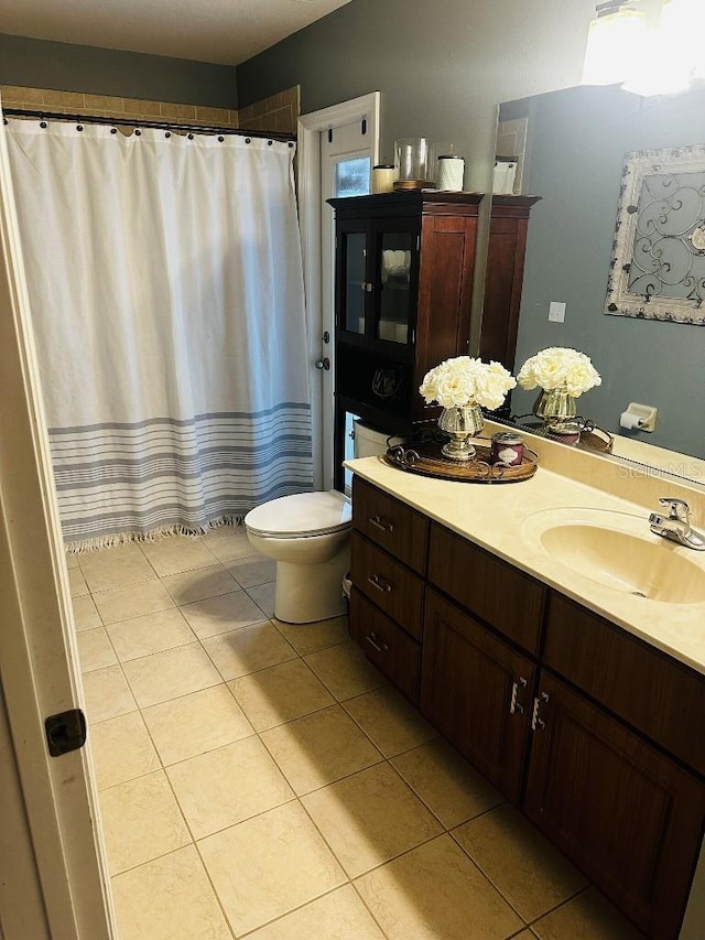 10080 SE 69th Ter, Belleview, FL 34420 - bathroom with tile patterned floors, vanity, and a shower with curtain
