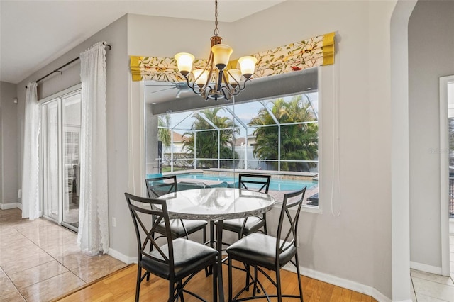 22623 Cliffside Way, Land O Lakes, FL 34639 - dining room with a chandelier and arched walkways