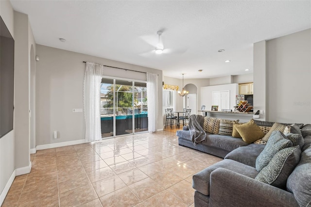 22623 Cliffside Way, Land O Lakes, FL 34639 - living area featuring a chandelier, ceiling fan, light tile patterned floors, recessed lighting, and arched walkways