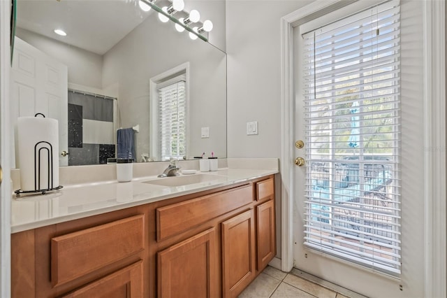 22623 Cliffside Way, Land O Lakes, FL 34639 - bathroom featuring tile patterned floors, vanity, plenty of natural light, and curtained shower