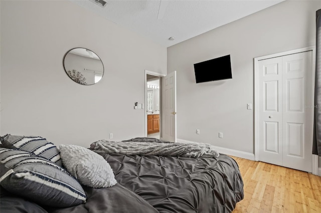 22623 Cliffside Way, Land O Lakes, FL 34639 - bedroom with light wood finished floors and baseboards