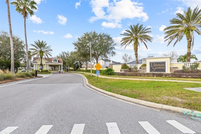 22623 Cliffside Way, Land O Lakes, FL 34639 - view of asphalt road featuring traffic signs, curbs, street lights, and sidewalks