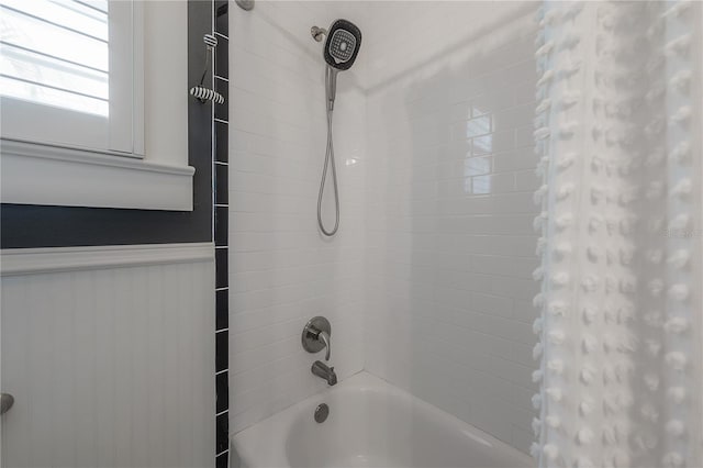 1407 S Moody Ave, Tampa, FL 33629 - bathroom with shower / bathtub combination with curtain and a wainscoted wall