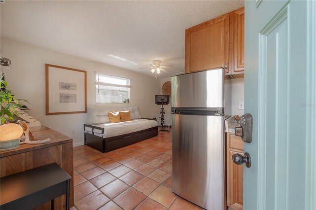 1407 S Moody Ave, Tampa, FL 33629 - kitchen with freestanding refrigerator, ceiling fan, light tile patterned flooring, a textured ceiling, and open floor plan