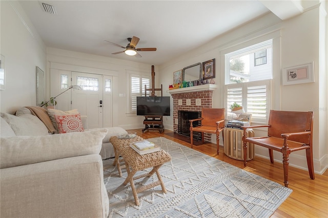 1407 S Moody Ave, Tampa, FL 33629 - living room with plenty of natural light, wood finished floors, ceiling fan, and a fireplace