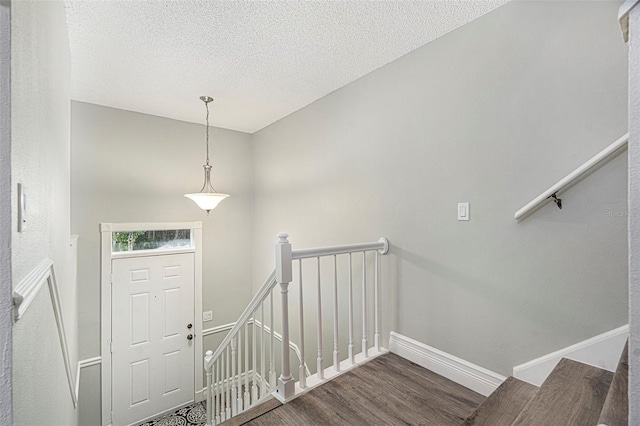 4117 Daventry Ln, Palm Harbor, FL 34685 - entrance foyer with wood finished floors and a textured ceiling