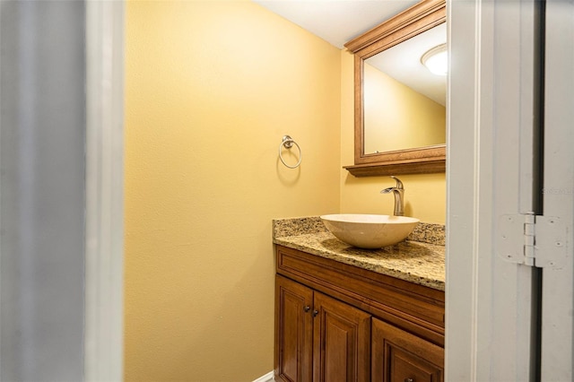 4117 Daventry Ln, Palm Harbor, FL 34685 - bathroom with vanity and baseboards