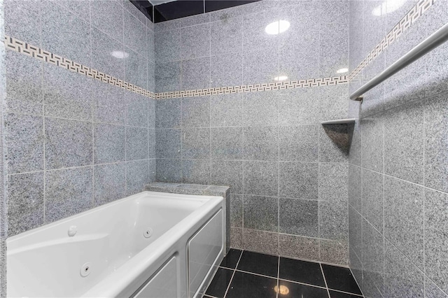 4117 Daventry Ln, Palm Harbor, FL 34685 - full bathroom with a jetted tub, tile patterned floors, and tile walls