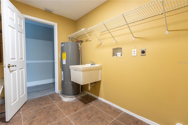 4117 Daventry Ln, Palm Harbor, FL 34685 - laundry room with water heater, electric dryer hookup, tile patterned floors, and washer hookup