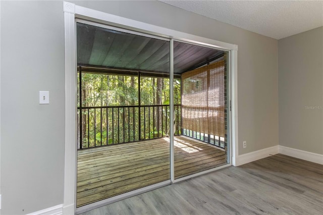 4117 Daventry Ln, Palm Harbor, FL 34685 - doorway with wood finished floors and baseboards
