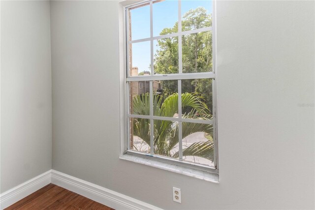 4117 Daventry Ln, Palm Harbor, FL 34685 - unfurnished room featuring baseboards and dark wood-style floors