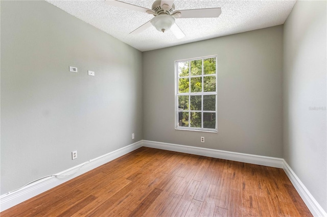 4117 Daventry Ln, Palm Harbor, FL 34685 - unfurnished room with hardwood / wood-style floors, a textured ceiling, and a ceiling fan