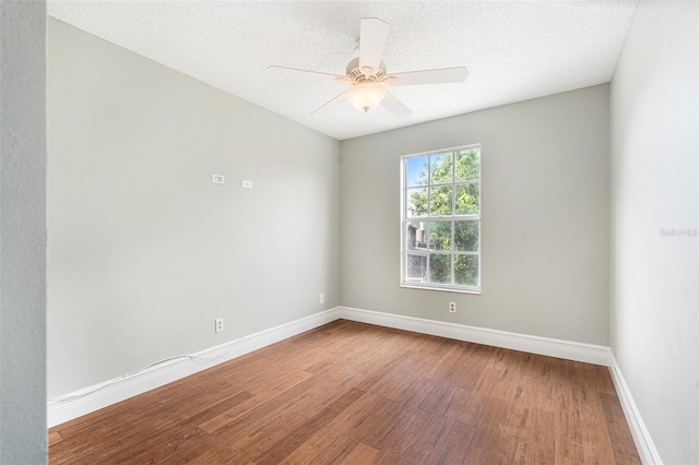 4117 Daventry Ln, Palm Harbor, FL 34685 - unfurnished room featuring wood finished floors, ceiling fan, and a textured ceiling
