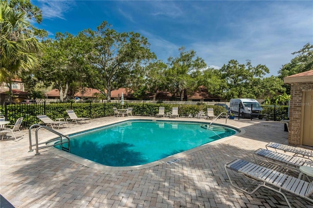 4117 Daventry Ln, Palm Harbor, FL 34685 - community pool featuring a patio